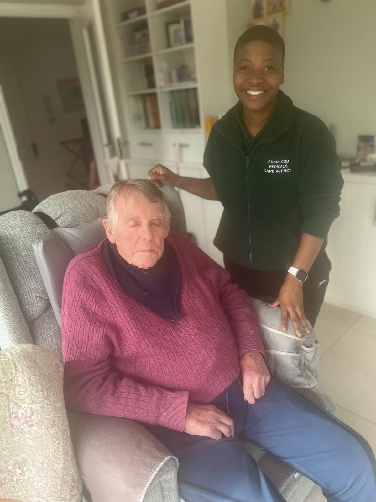 Evergood Medicals live-in carer enjoying an evening at home with a client in Crawley