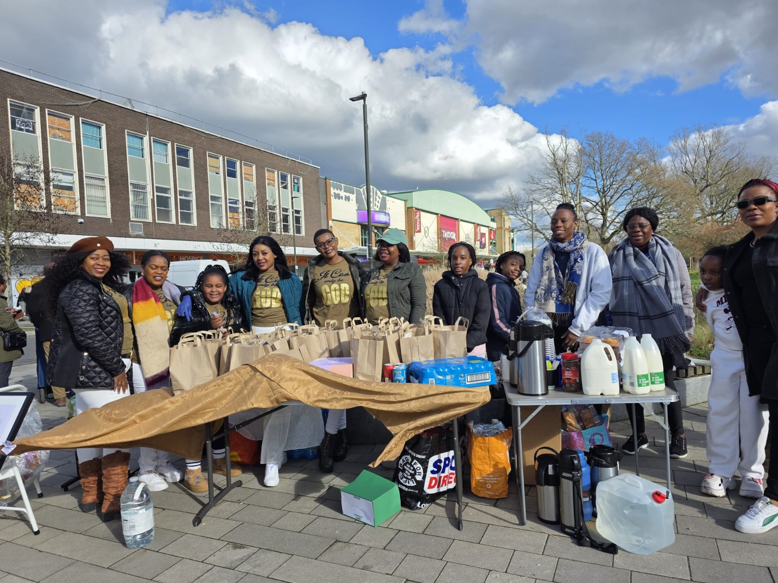Evergood Medicals volunteers handing out food bags at a Crawley community event