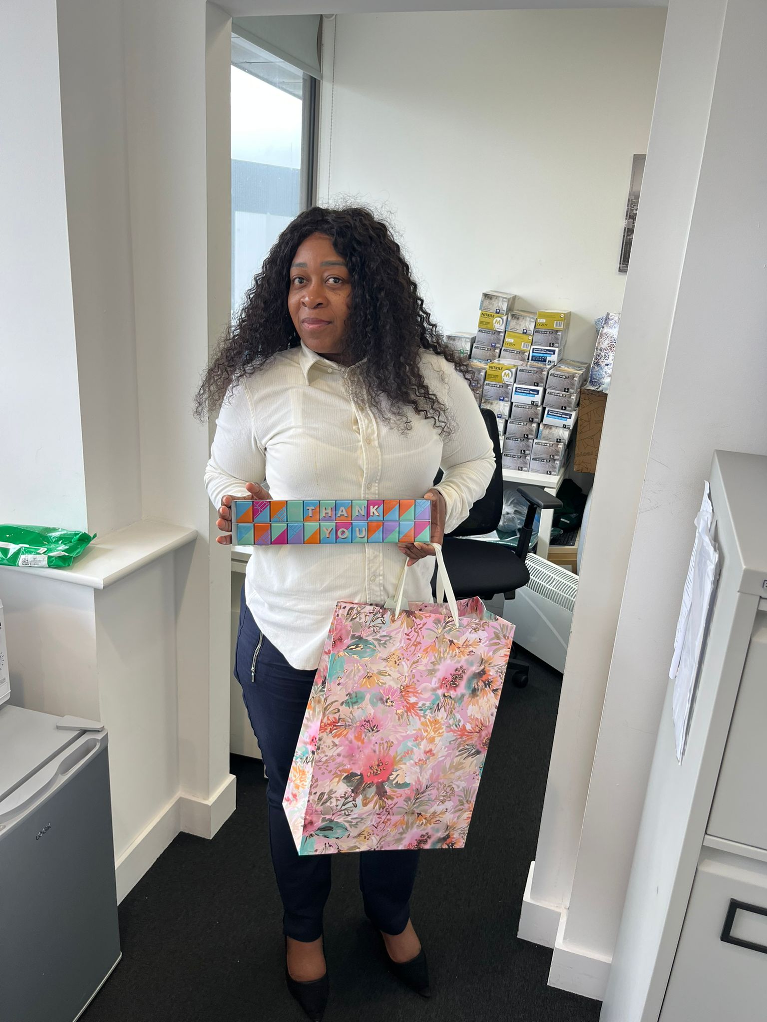An Evergood Medicals team member with presents from grateful clients